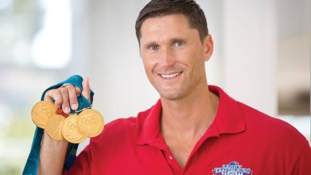 SwimRight Academy founder with Olympic medals